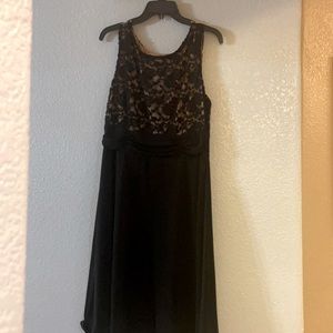 Black dress with a lace flower pattern